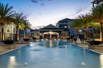 Resort-Style Pool Lit Up At Night